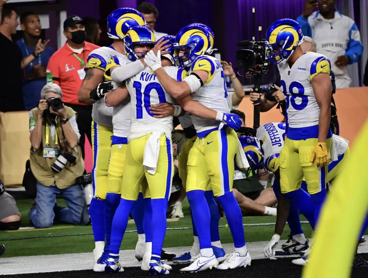 Sports stadium lit up with flashing lights, various sports equipment on field Sports stadium lit up with flashing lights, various sports equipment on field